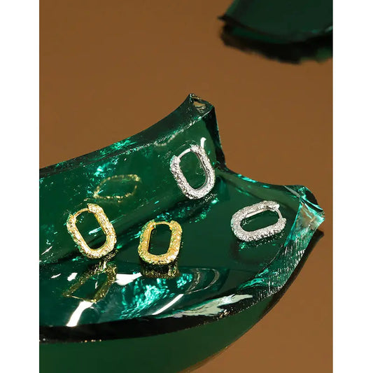 Oval Textured Silver Huggie Earrings