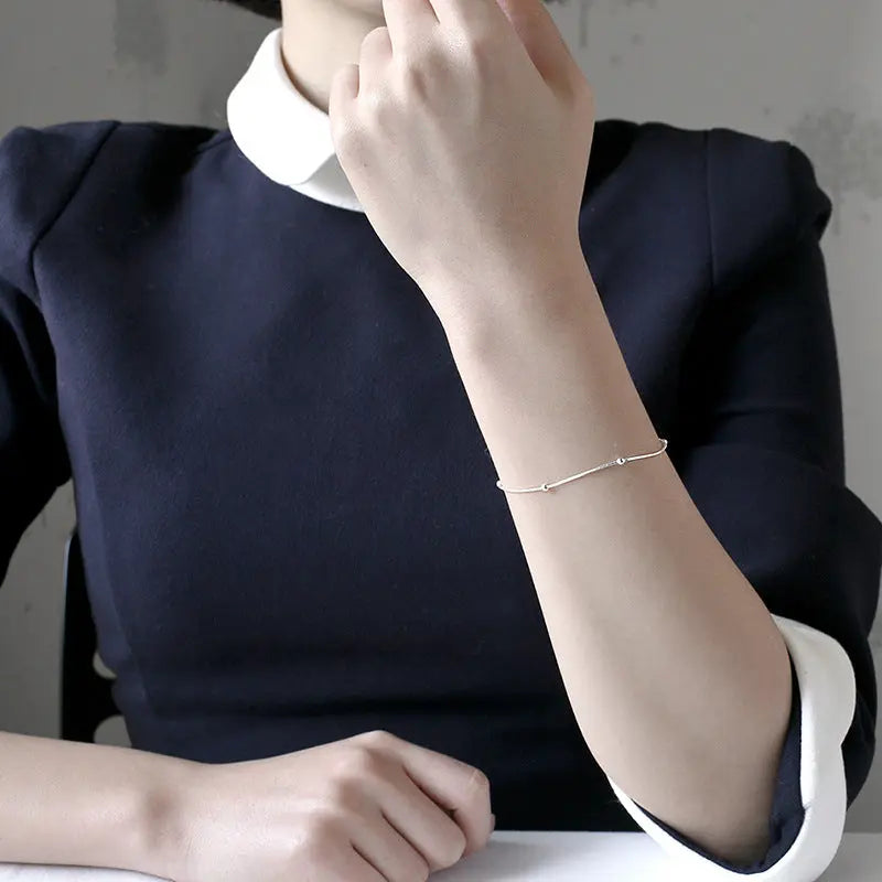 ATHENA'S ROUND BEAD SNAKE BONE SILVER BRACELET - OPHRASTUDIO