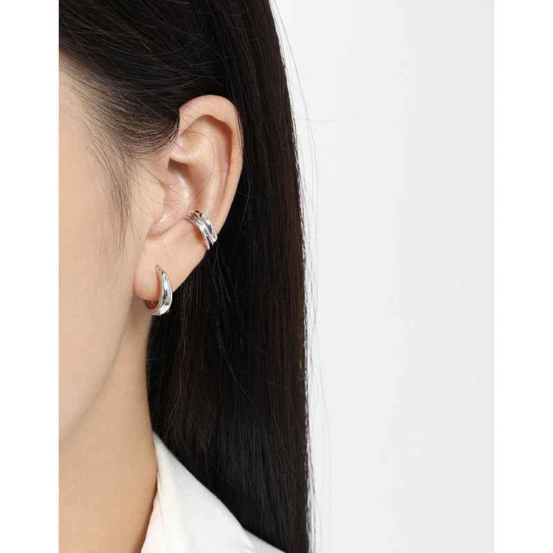 Isabella's Geometric Circle Silver Huggie Earrings