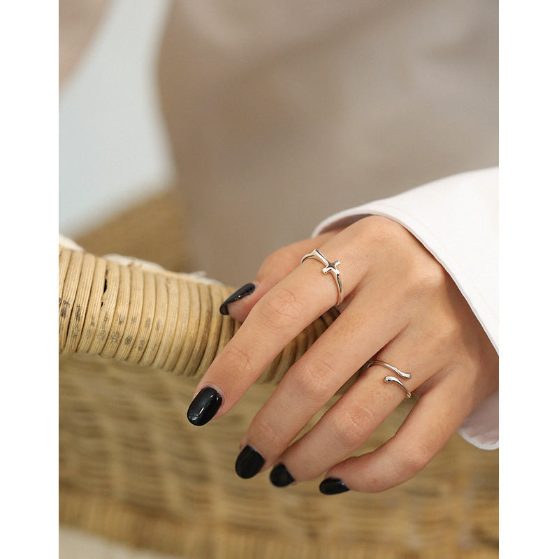 SLEEK SILVER CROSS RING OPHRASTUDIO