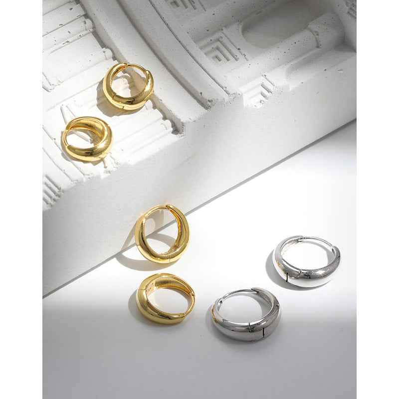 Isabella's Geometric Circle Silver Huggie Earrings