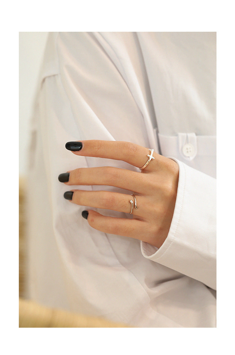 SLEEK SILVER CROSS RING OPHRASTUDIO