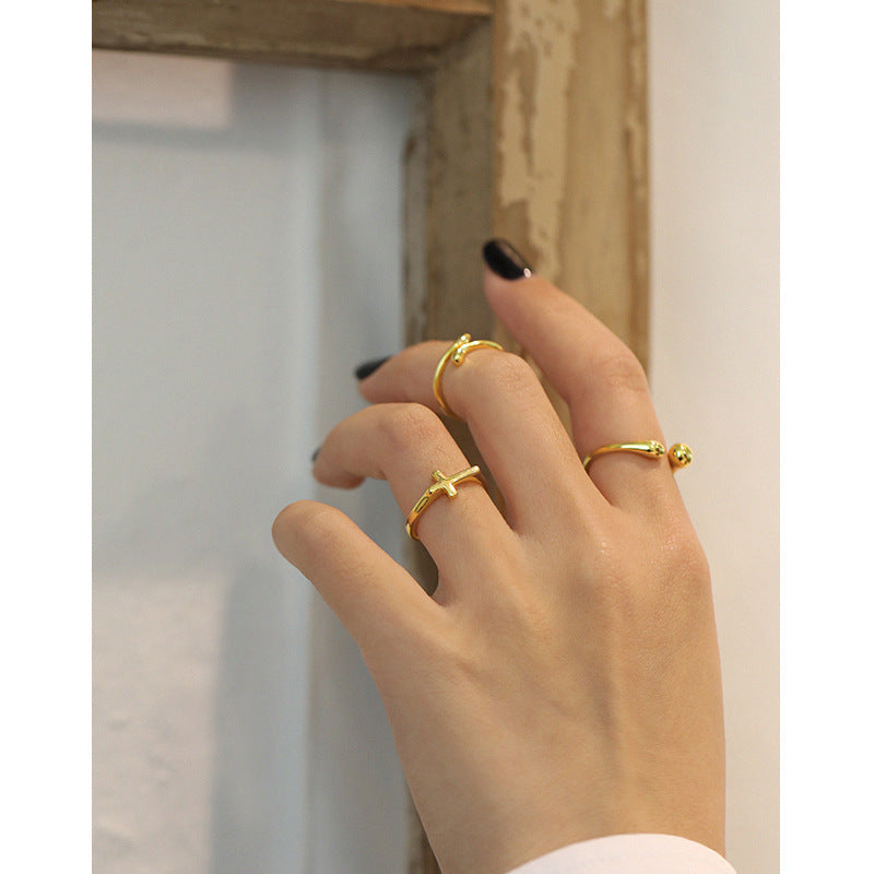 SLEEK SILVER CROSS RING OPHRASTUDIO