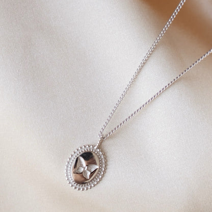 Collana con ciondolo a farfalla in argento con moneta