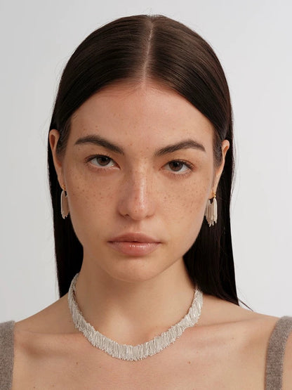 Whisper Tassel Earrings Lightweight elegance with a whisper of motion. These earrings feature fine tassel chains that sway gently with every step — effortless, graceful, unforgettable OPHRASTUDIO