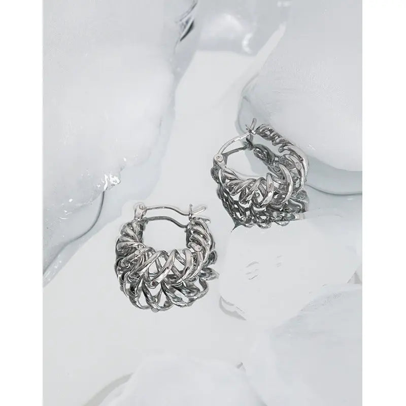 Orecchini a cerchio in argento Croissant Twist Orecchini a cerchio in argento Croissant Twist
